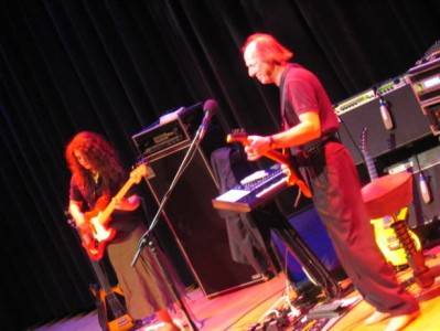 img_6065 Julie Slick and Adrian Belew onstage at the Rock and Roll Hall of Fame in Cleveland, Ohio, Feb 2007. Photo courtesy Robin Slick
