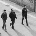 U2 band members walking black and white photo