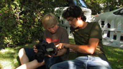 Adrian Grenier and Austin Visschedyk in Teenage Paparazzo.