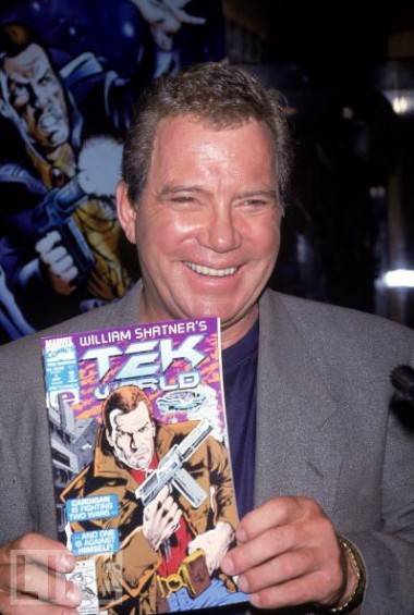 William Shatner with a copy of a Tek comic book.