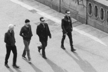 U2 band members walking black and white photo movies and TV